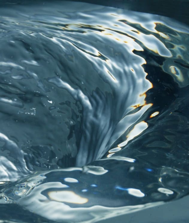 Swirling Water Sparkles And Reflects Silver And Gold Colors