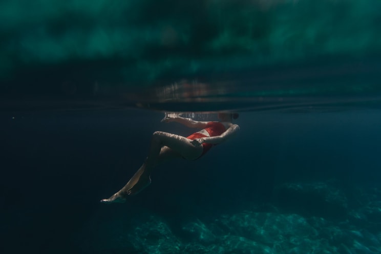 A Woman Swimming Underwater