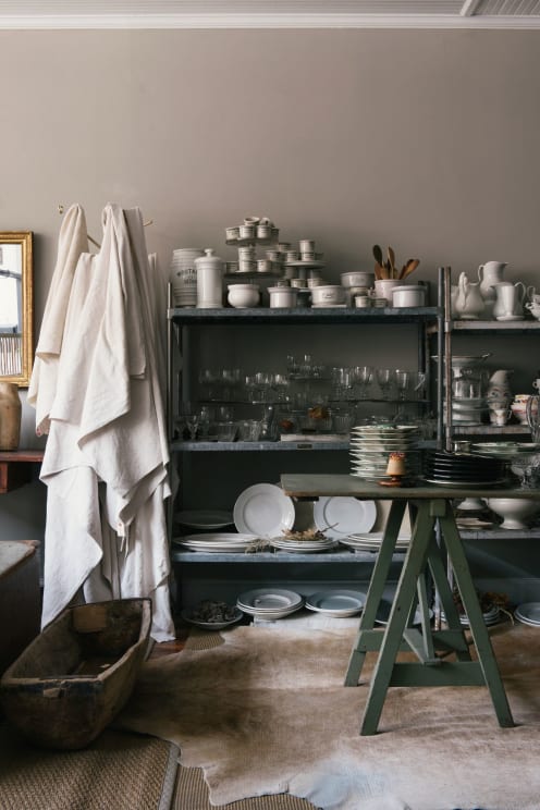 A Neutral Indoor Space With Wooden Cabinets And Grey Kitchen Appliances