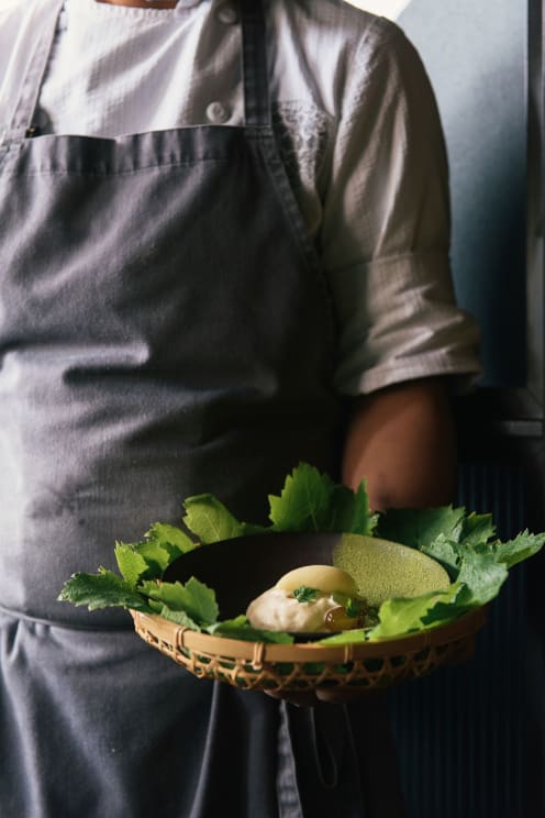 A Person Serves A Vegetable Meal