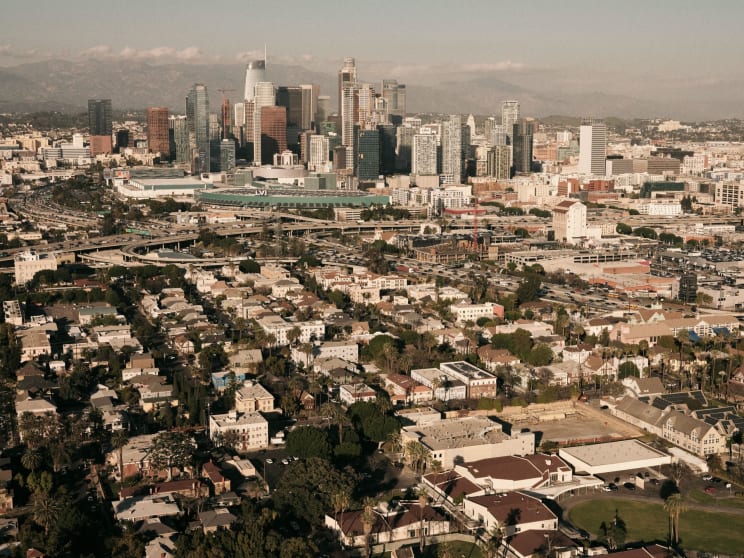 Skyscrapers Overshadow Residential Homes In A City