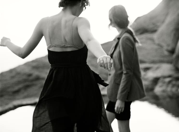 A Woman Dancing In An Outdoor Landscape