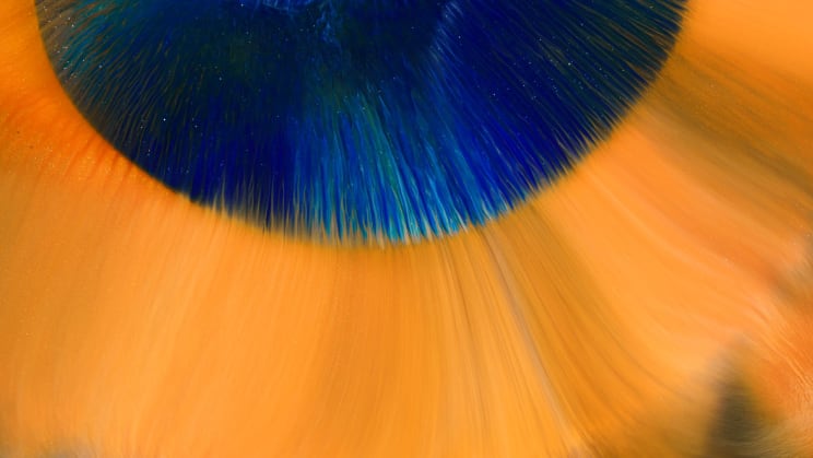Blue Liquid Is Surrounded By Orange Liquid