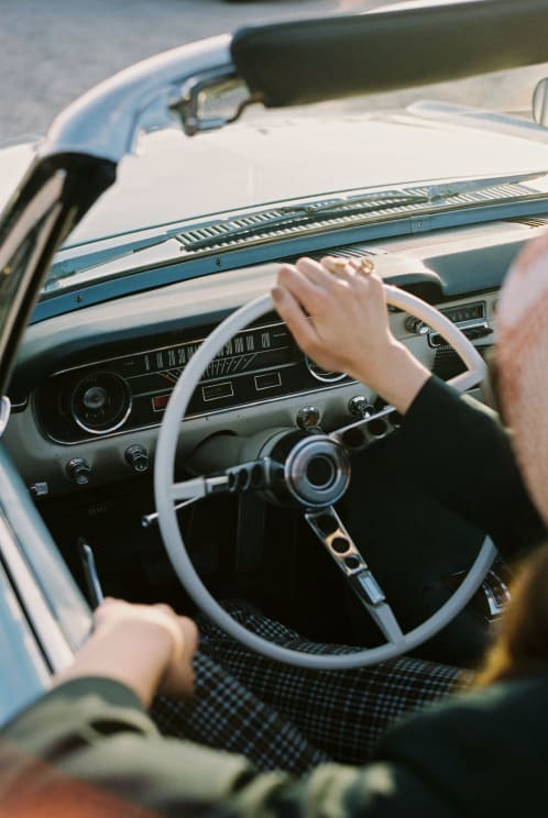 A Person Driving A Car