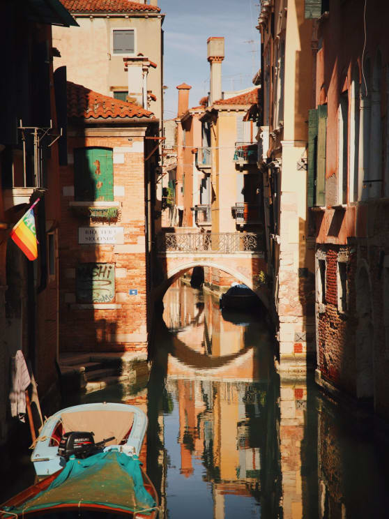 Colorful Apartment Buildings Reflect Onto The River Below