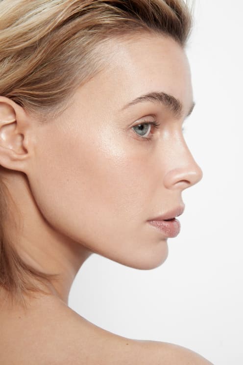Profile Of A Young Beautiful Blonde Woman With Green Eyes