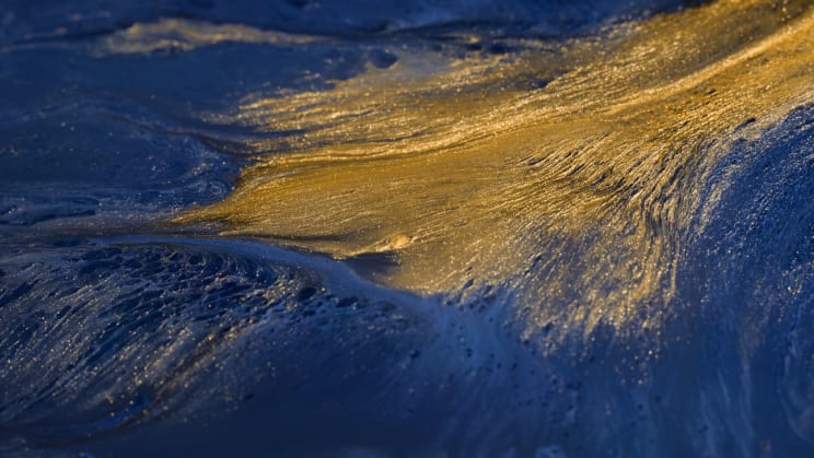 Abstract And Liquid Art Imitating The Sea With Shades Of Blue And Gold