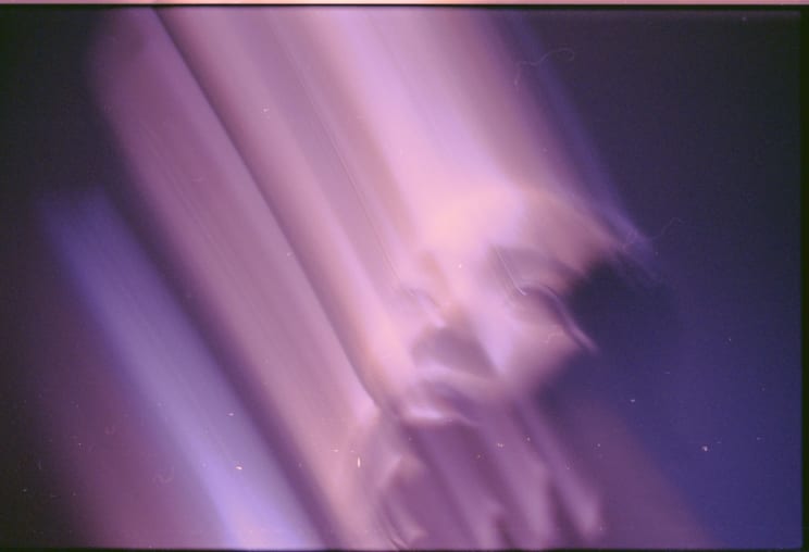 A Portrait Of A Woman With Blurred Lines Coming Off Of It