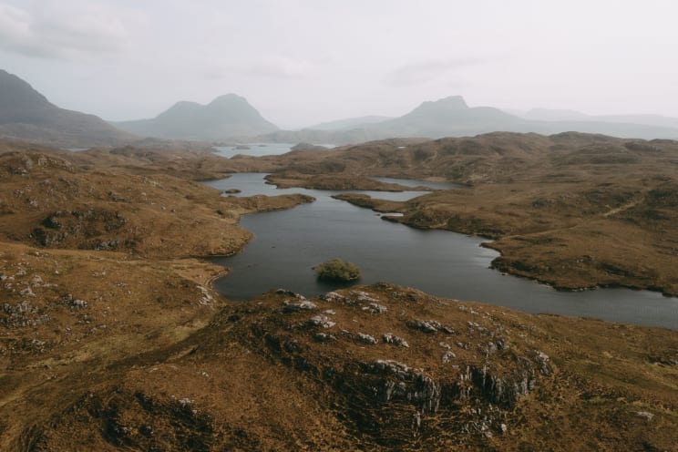 The Landscape Of River And Brown Hills