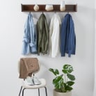 Selection of clothes handing up on pegs