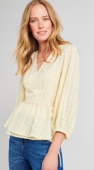 Woman in yellow top and jeans