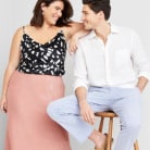 Woman and man smiling in nice clothes