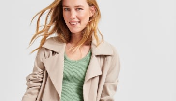 Woman in green top and jacket