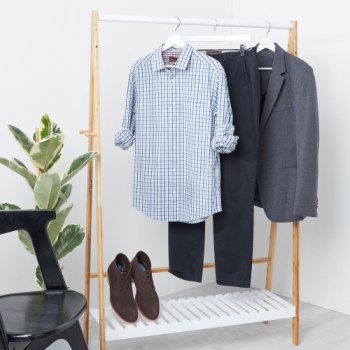A rail full of smart men’s clothes and shoes