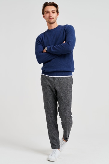 Blue jumper, grey trousers and trainers