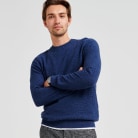 Navy blue jumper with grey trousers