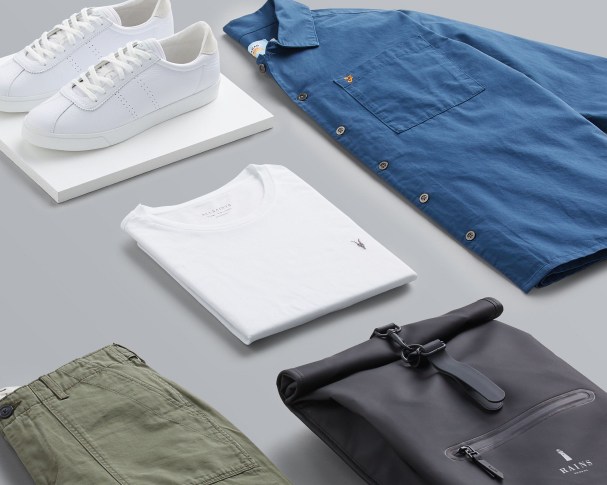 Stitch Fix X County Capsules London popular hipster men's outfit featuring a chambray shirt, a black leather backpack, a white t-shirt and white sneakers.