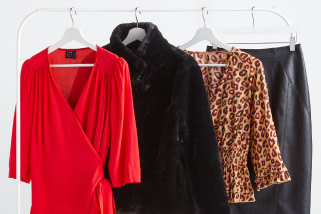 Stitch Fix X County Capsules popular Essex women's clothes rack featuring a red wrap top with long sleeves, a black faux fur coat, a leopard print shirt and a leather pencil skirt.