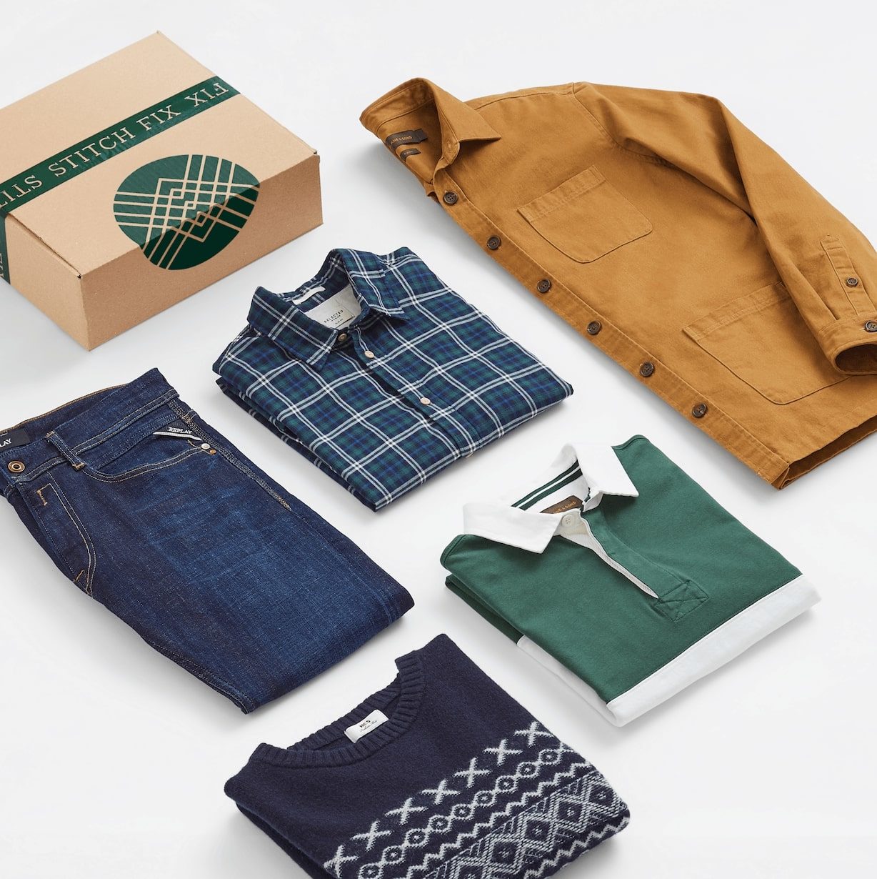 Men's clothing laid down beside a box