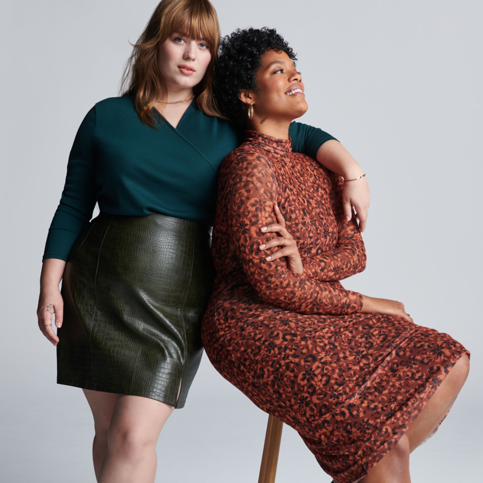 Two models wearing Stitch Fix women’s clothing including, a green bodysuit and mocha dress.