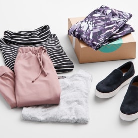 Activewear clothing including pink jogger pants, white shirt, grey shirt, purple patterned pants and black sneakers.