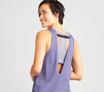 Layered purple and grey yoga top with strap detail.