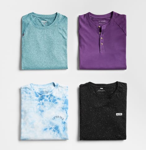 Men’s workout tops in teal, purple, tie-dye and black.