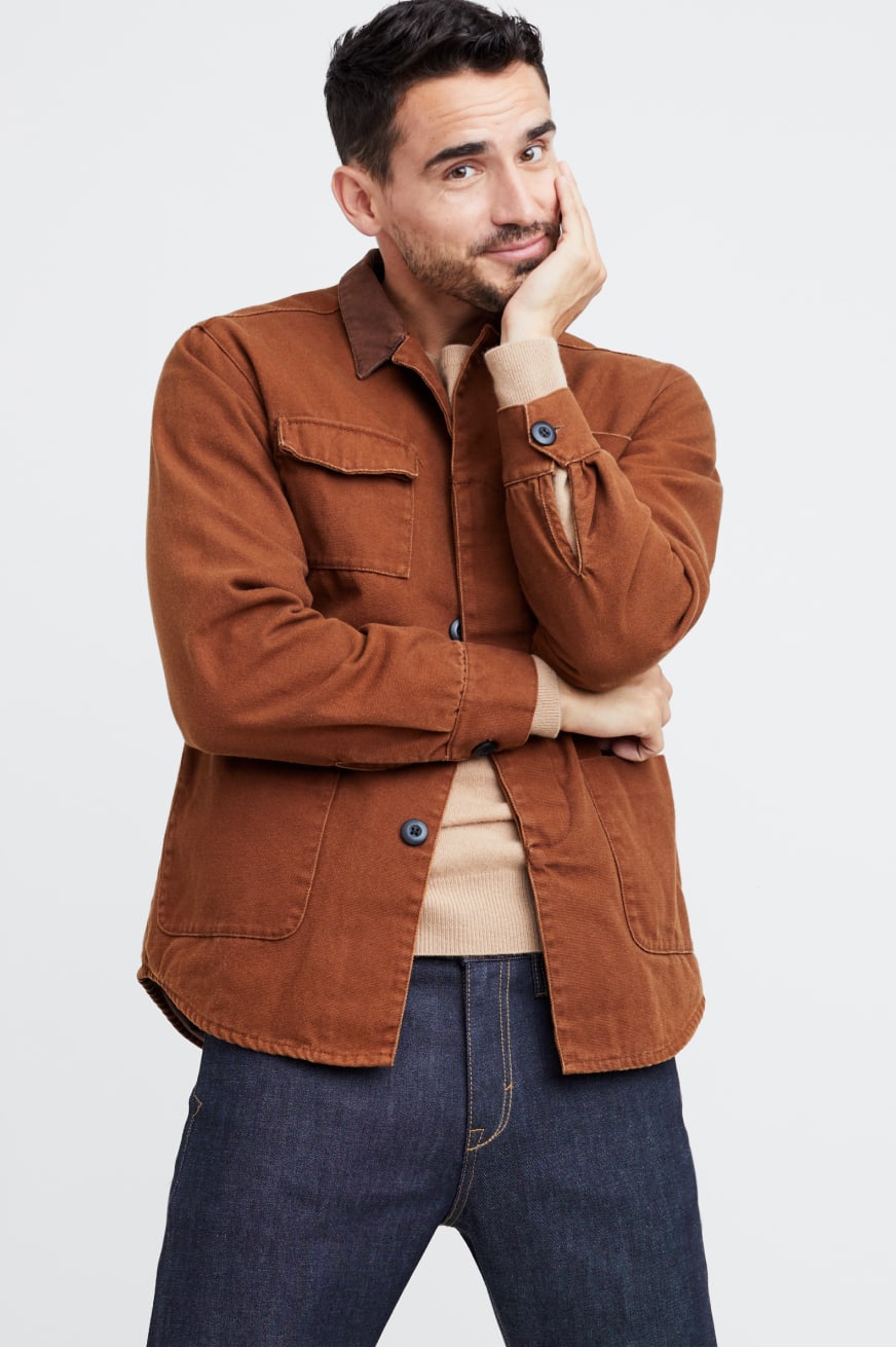 Stitch Fix men’s clothes including a brown button shirt, tan t-shirt and jeans.