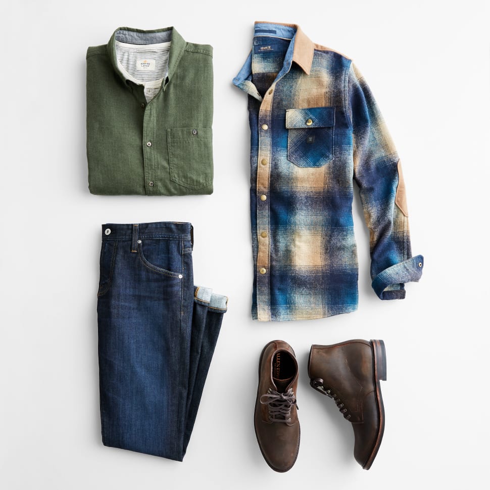 Stitch Fix men’s clothes including an olive shirt, blue plaid shirt, jeans and brown leather boots.