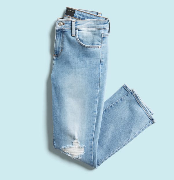 Light wash jeans with knee distressing.