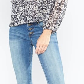 Medium wash jeans with floral top.