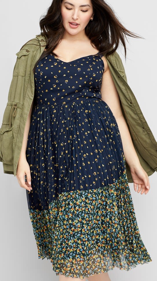 Woman wearing Stitch Fix clothing including spring dress and green utility jacket