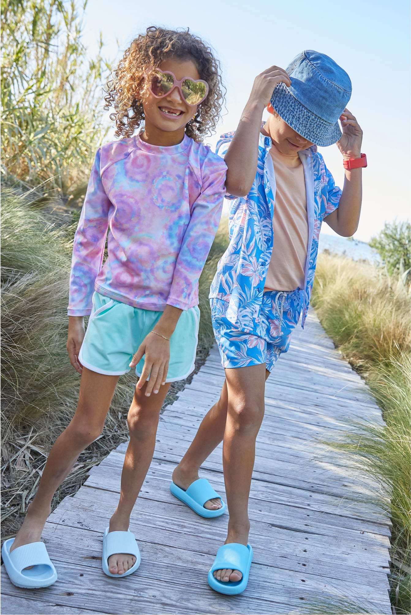 Two kids at beach wearing Stitch Fix kids bright colorful printed Stitch Fix kids clothing