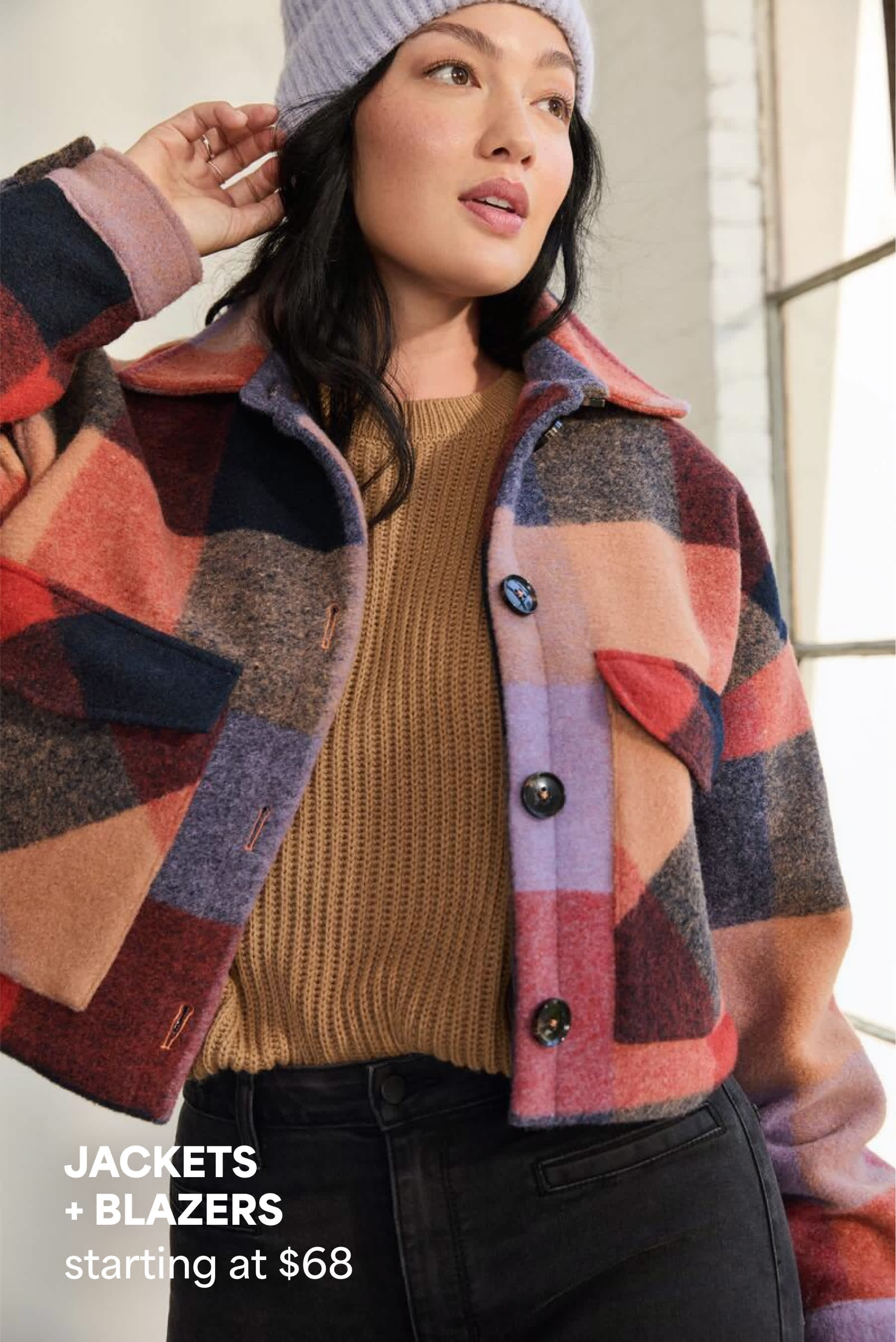 Model wearing Stitch Fix women’s clothes: colorful plaid shacket and sweater.