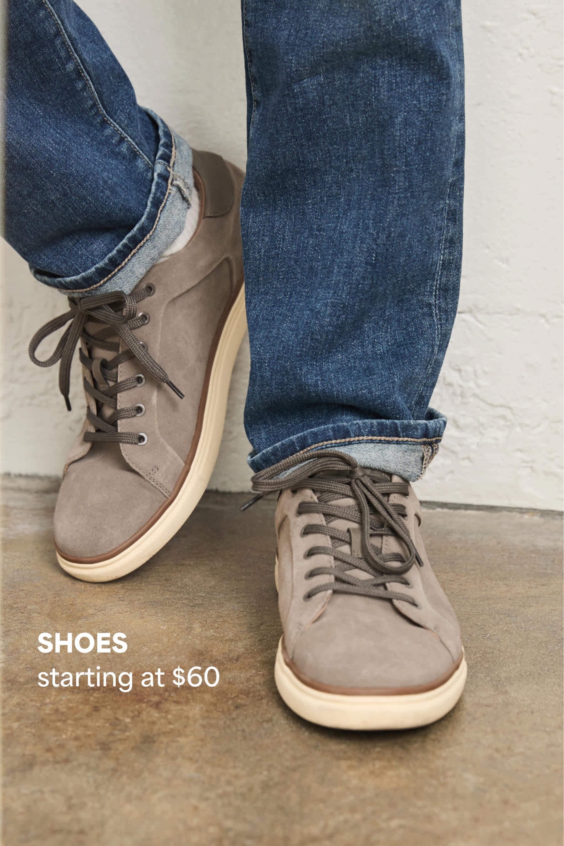 Model wearing Stitch Fix men’s clothes: suede sneakers and jeans. 