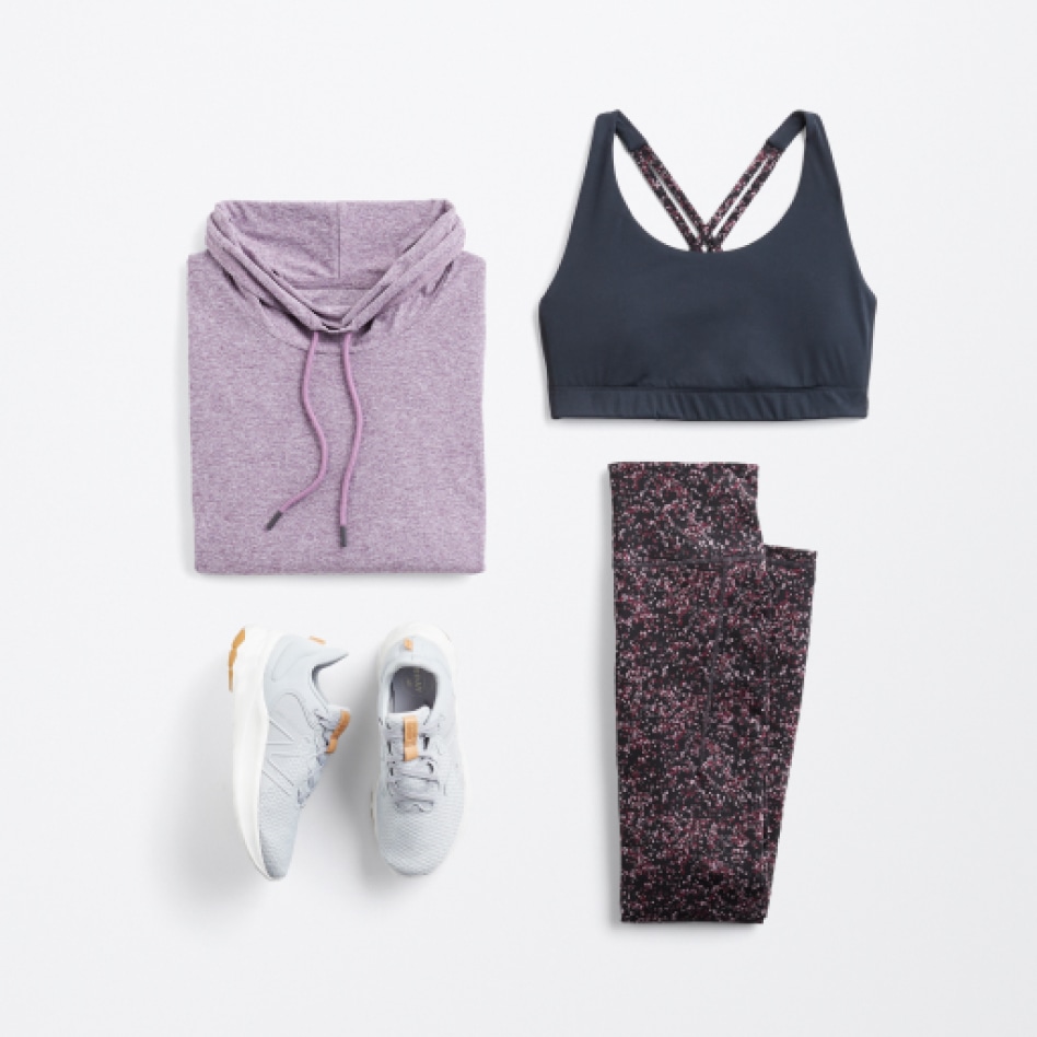 Stitch Fix We Wander women’s clothing including navy criss cross top, dark print leggings and light purple performance pullover.