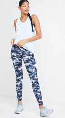 Activewear outfit including a white tank top and blue camo leggings.