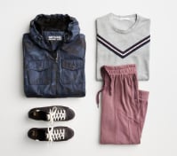 Activewear outfit including a blue windbreaker jacket, white striped tee, sneakers and pink jogger pants.
