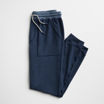 Men’s jogger pants in navy blue with drawstring closure.