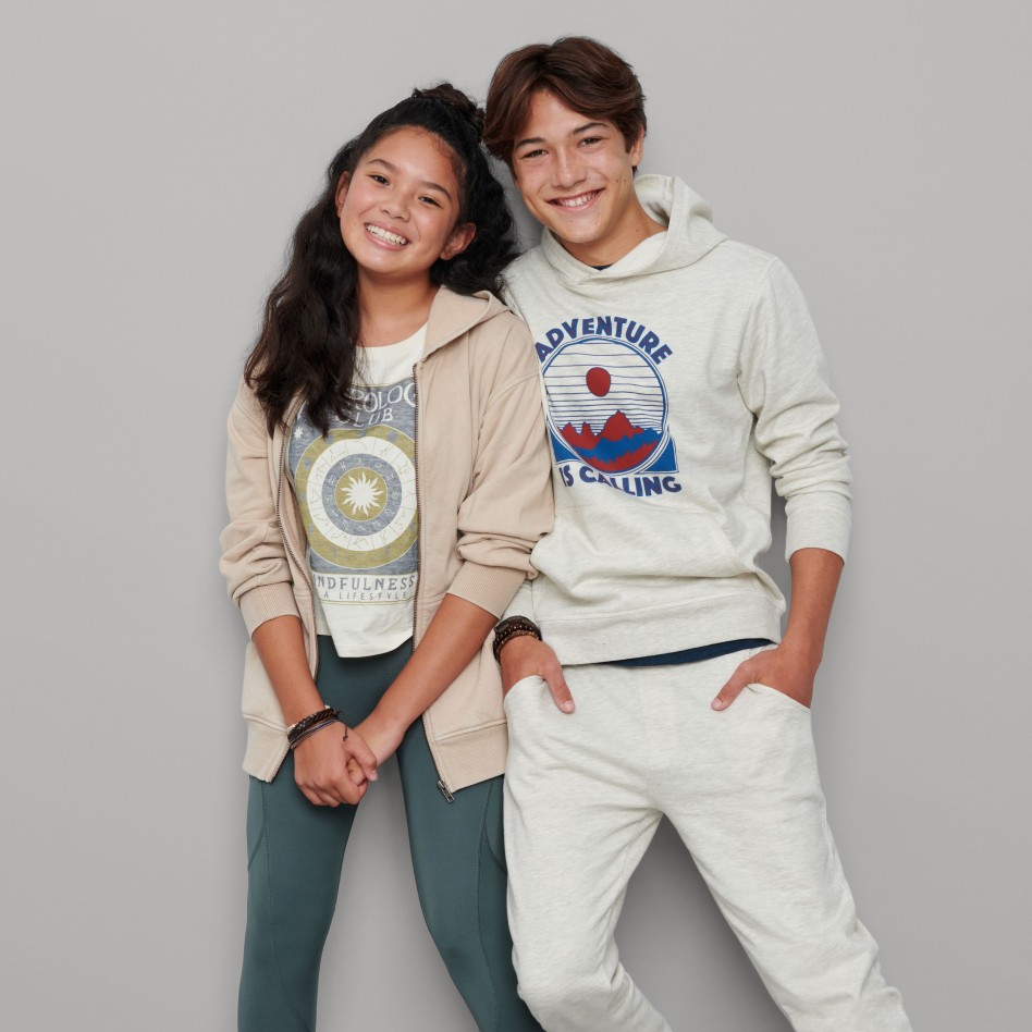 Models wearing Stitch Fix kid’s clothing including sweatshirts, graphic tees, leggings and sweat pants.