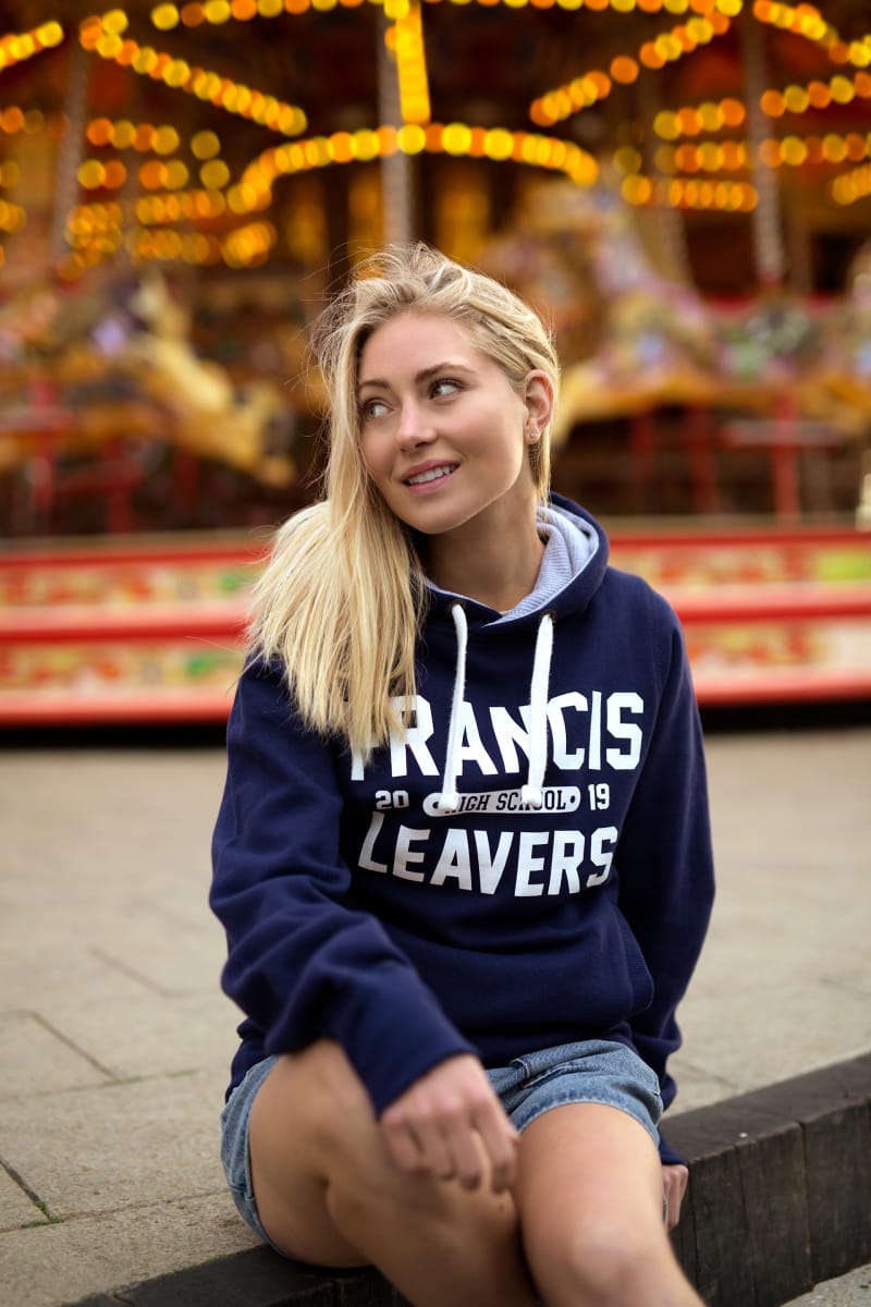 Model wears our Chunky Hoodie in navy colour with large printed leavers design