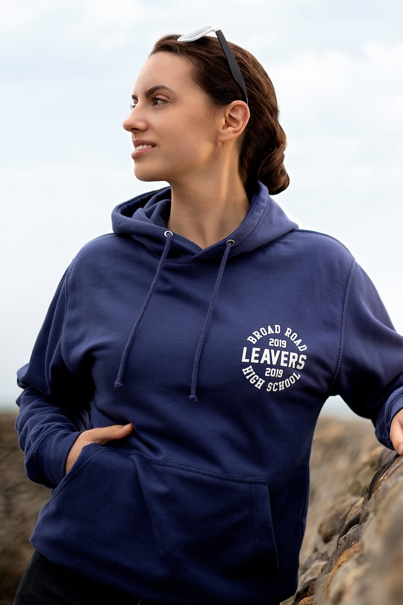 Model wears our College Hoodie in denim blue colour with small printed leavers logo