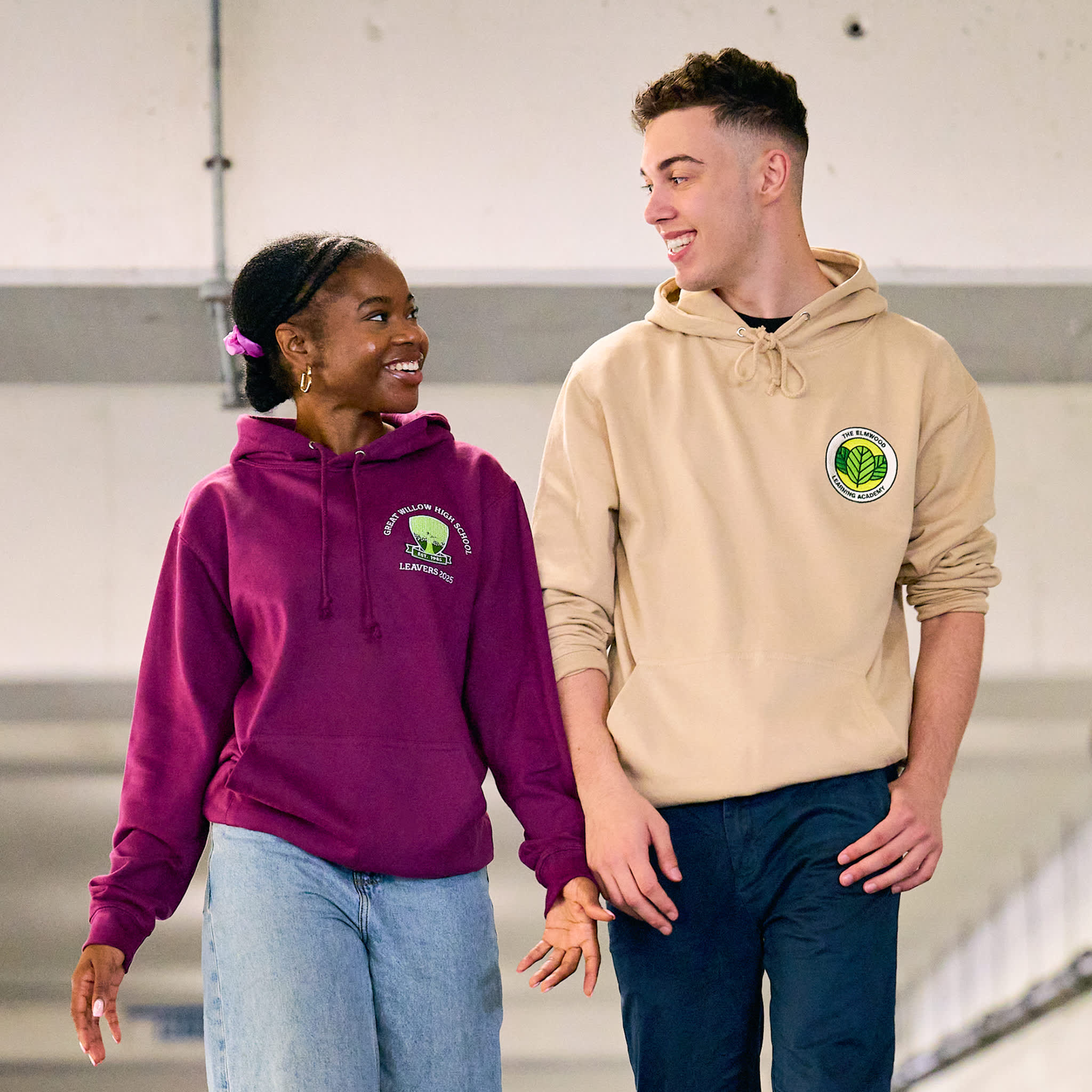 Models wear our College Hoodie (adult size) in plum (left) and desert sand (right)
