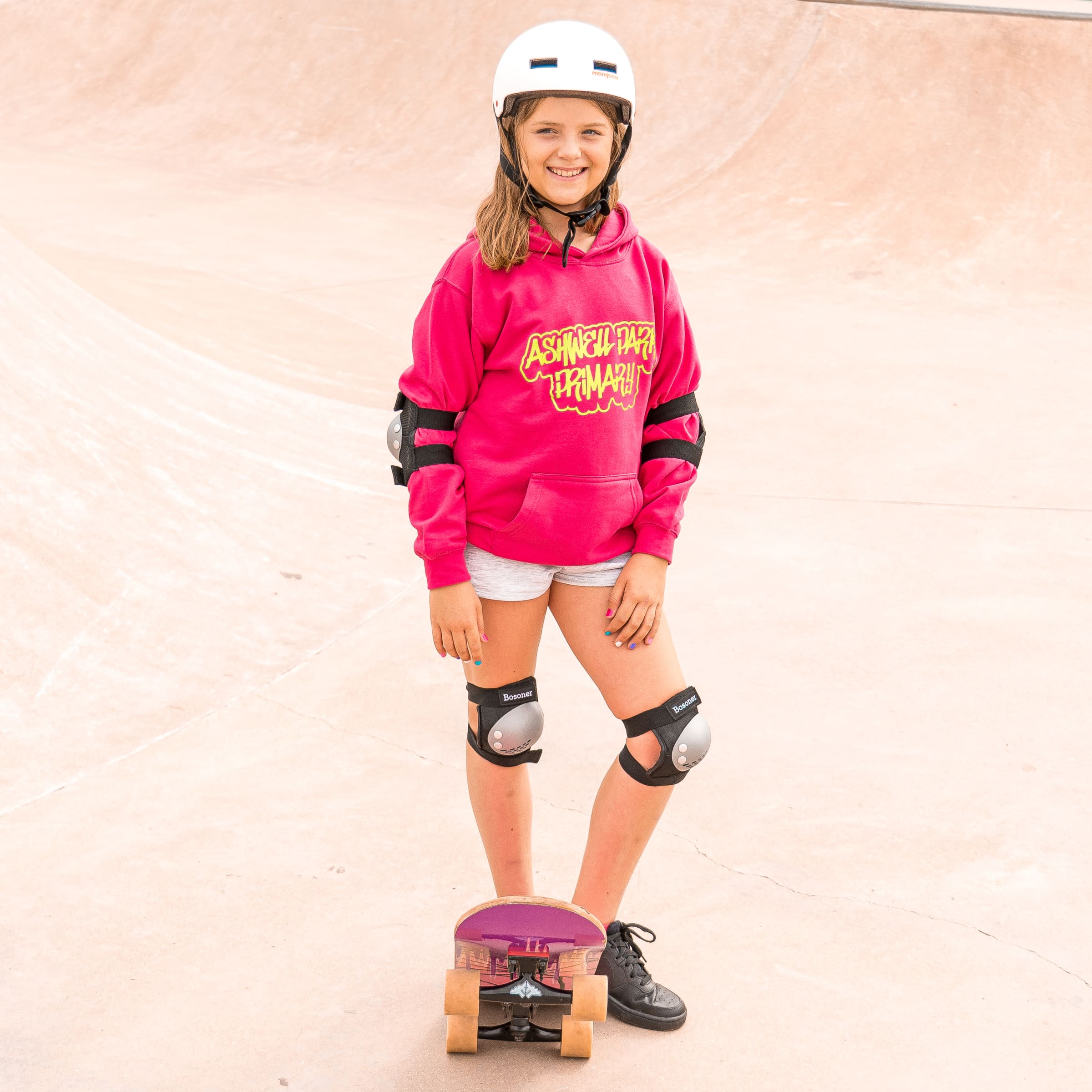 Model wears our College Hoodie (child size) in hot pink