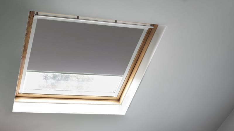 Arena Bloc Fossil Grey skylight blind in a loft living room