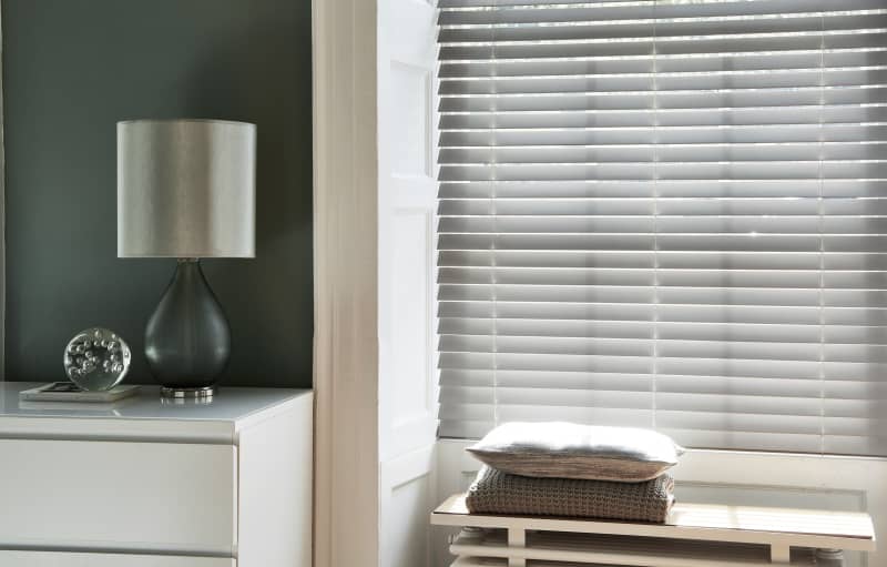 Arena Essence Canvas faux wood blind in a bedroom