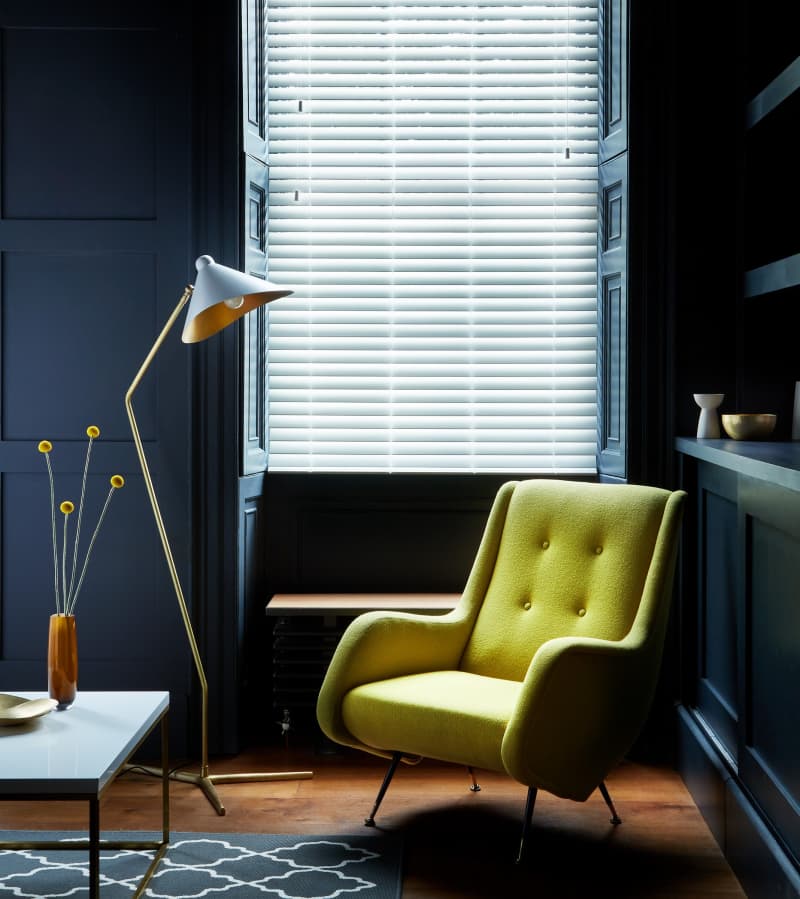 Arena Vellum White faux wood blind in a living room