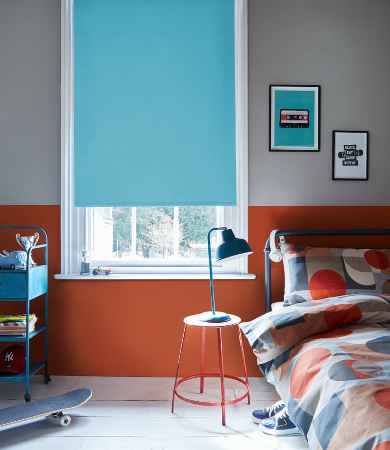 Arena Polaris blackout Aqua roller blind in a bedroom