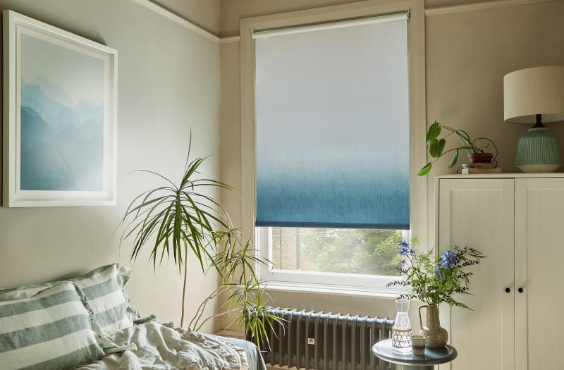Arena teal ombre roller blind in a living room