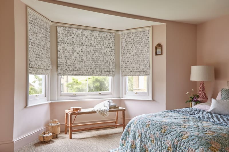 Arena Vega Natural Roman blinds in a bay window